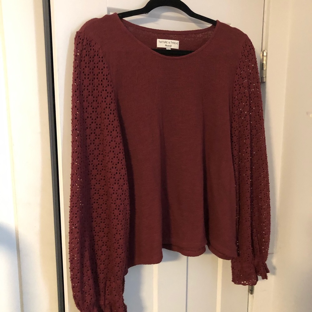 Dark red sweater with detailed sleeves
